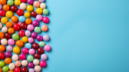 Obraz premium Skittles candy on blue background texture wallpaper. Free space for text. Candy like skittles. YumEarth Organic Sour Giggles. Horizontal banner format