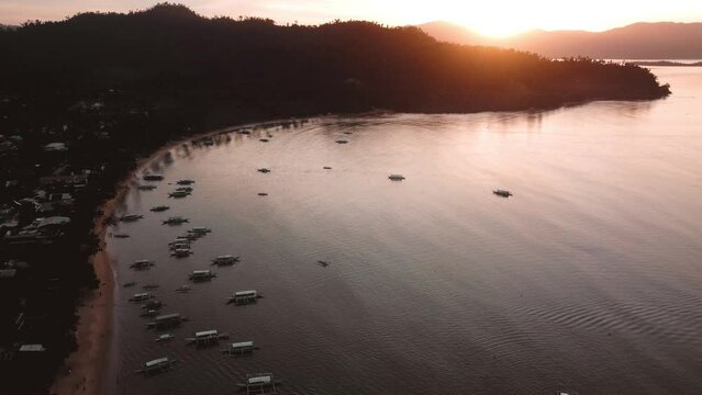 Aerial view 4k over Port Barton Harbour in Palawan, the Philippines, on a sunny morning. blue seas and skies and sunrises and misty mornings.