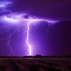 A lightning strike in a field with purple sky and dark clouds.