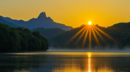 The sun rises over a mountain and shines on a lake