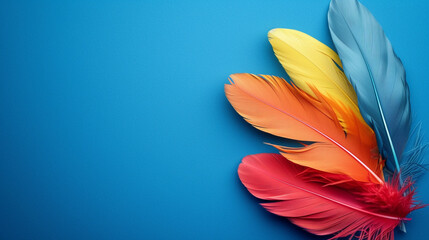 Naklejka premium Vibrant colored beautiful bird feathers. Isolated on a toned bright-colored background.