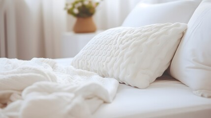 Fototapeta na wymiar synthetic blanket and pillow on a white sheet. Selective focus