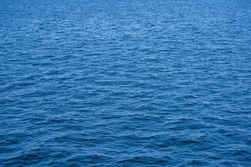 Blank view with blue reflections of ocean waves as background