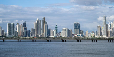 Middle view of Panama City skyline with El Tornillo with bridge and sea in front