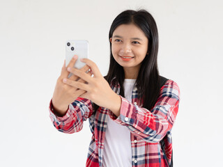 Asian young girl using smartphone at school.