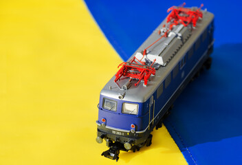 Ukrainian flag and train locomotive model.