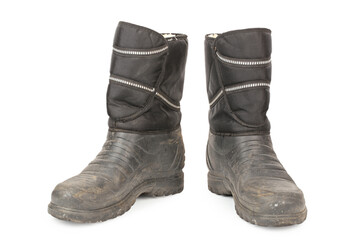 Dirty insulated old boots on a white background. Hiking boots.
