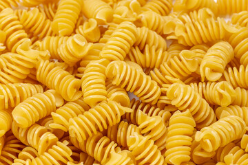 Background from Pasta. Fusilli spirale texture.