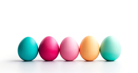 Colorful Easter eggs isolated on white background. Five brightly colored eggs are lined up on a white table. Happy Easter concept.