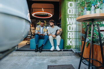 Multiracial Team of Business Professionals Engaged in Collaborative Brainstorming Session in Modern Office Setting