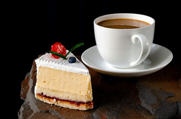 Dessert. A slice of cherry cake and a cup of coffee