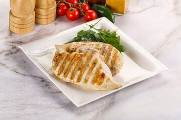 Grilled chicken breast served arugula
