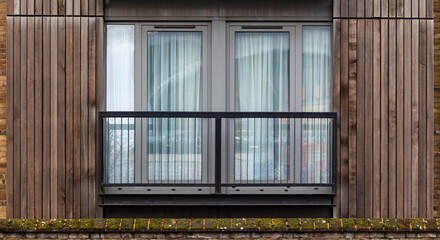 modern minimalist balcony with vertical dark wooden planks