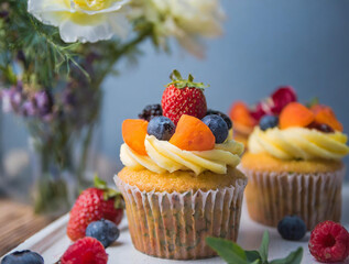 colorful cupcakes with fruits and decorations, rustic, sweet table, restaurant, cafe
