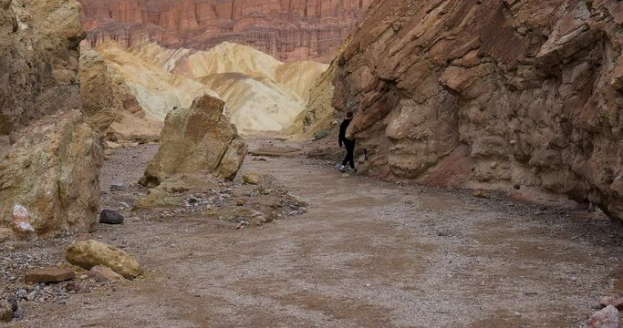 Death Valley friends hiking narrow slot canyon. Largest national park in contiguous USA. 282 feet below sea level. Mojave Desert bordering Great Basin Desert. Ecological geology. 