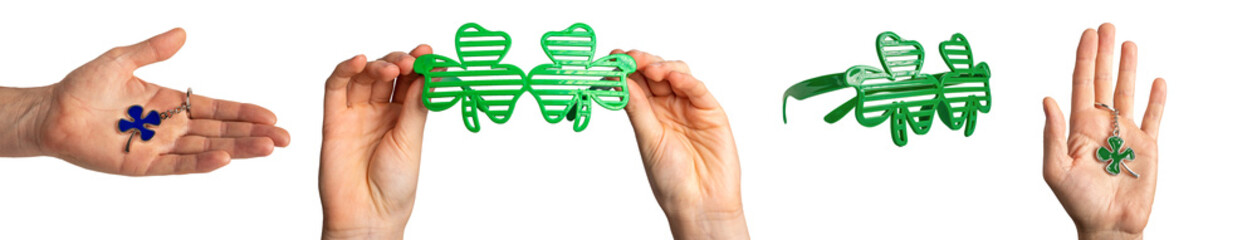 Hands holding shamrock glasses, green leaf shaped trinket. Irish accessories set for St Patricks day