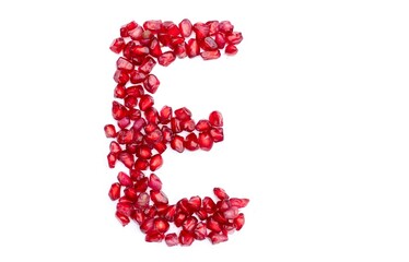 E English Alphabet Capital Letter Written with Pomegranate Seeds Isolated on White Background