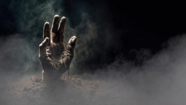 Zombie Hand Coming out of the Dirt Surrounded. By Fog
