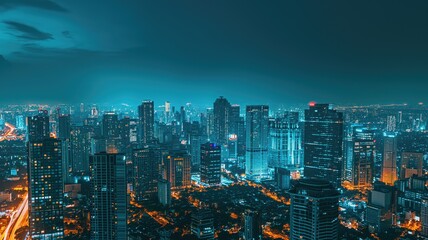 A panoramic view of a vibrant cityscape illuminated at night