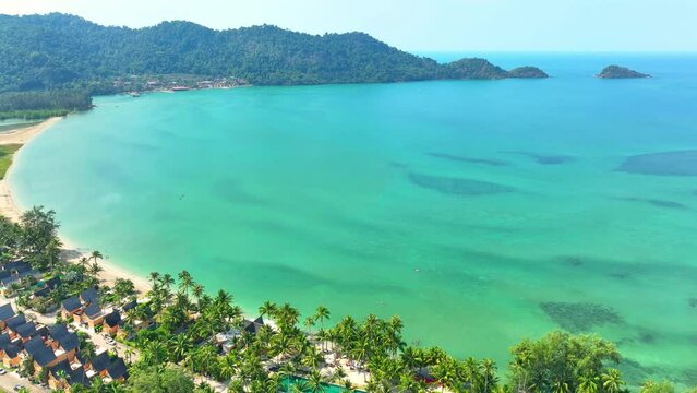Aerial drone captures stunning tropical paradise, Azure waters meet vibrant, lush green coastline in breathtaking harmony. Nature reserves concept. Stock footage. Mu Ko Chang National Park, Thailand.
