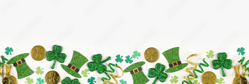 Poster st patricks day bottom border of green shamrocks, leprechaun hats, gold coins and ribbon. top down v