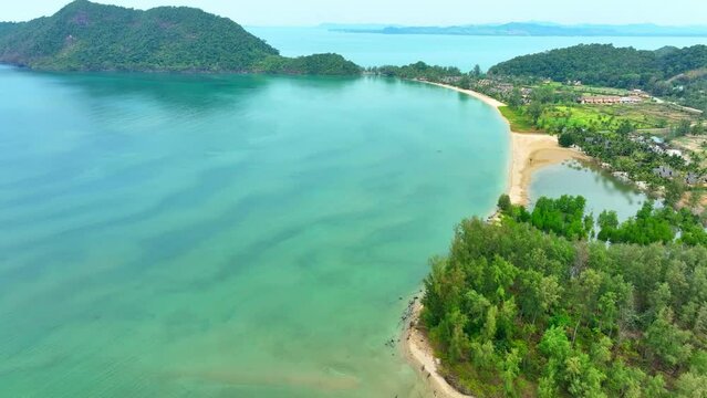 A mesmerizing vista of tropical paradise captured by a drone, revealing the breathtaking beauty of the azure sea. Wildlife conservation concept. Nature stock footage. Ko Chang, Thailand. 4K.
