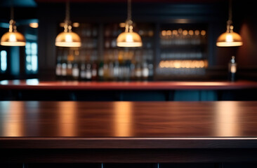 Empty wooden bar counter against the background of lamps, bottles and glasses in the pub, copy space