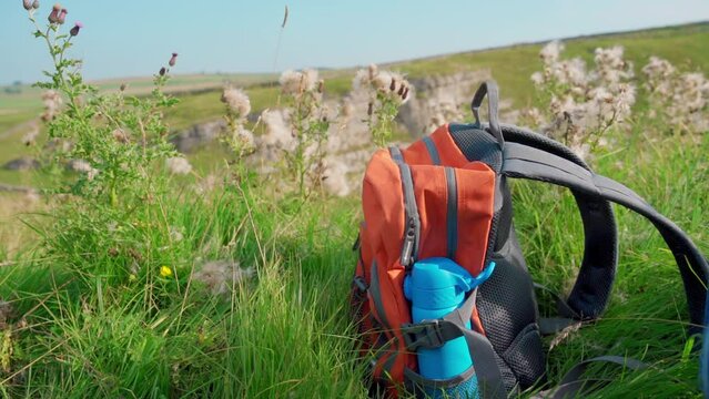 Woman reaching the destination and sitting on the top of mountain. Travel Lifestyle concept The national park Peak District in England	