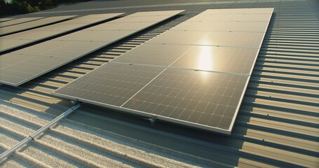 solar panels on a corrugated metal roof reflecting sunlight, showcasing alternative energy,...