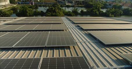 solar panels on a corrugated metal roof reflecting sunlight, showcasing alternative energy,...