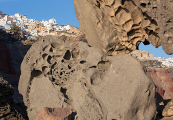 Santorini - The look to  Oia across the pumice boulders.