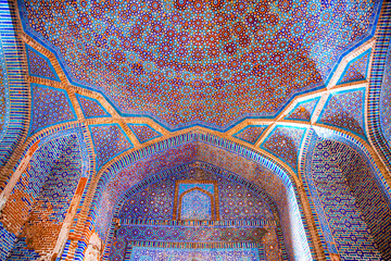 Beautiful traditional ceiling, mosaic of golden, blue and orange colors in Shah Jahan Mosque in...