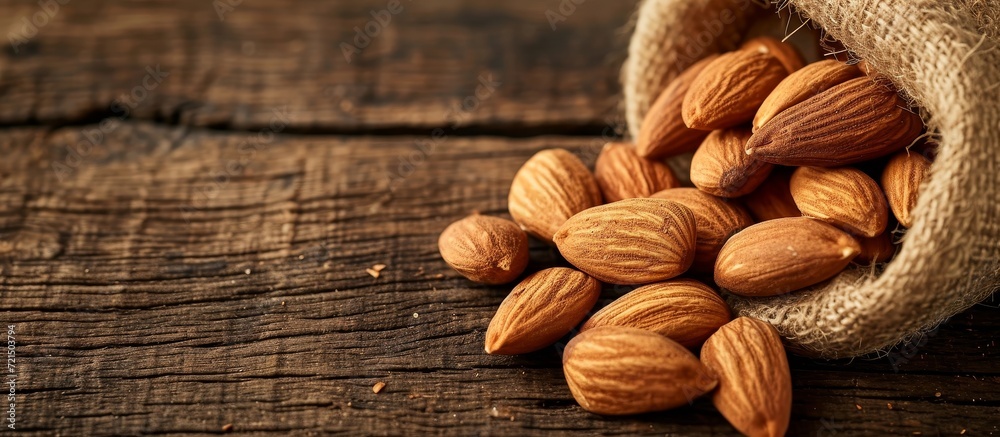 Wall mural Delicious Almonds on a Rustic Wooden Background - Almonds, Wood, and Background Perfection - Wall murals