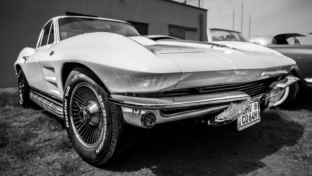 WERDER (HAVEL), GERMANY - MAY 20, 2023: The sports car Chevrolet Corvette Sting Ray (C2), 1964. Black and white. Oldtimer - Festival Werder Classics 2023