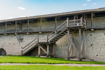 Fototapeta na wymiar Pskov, Russia, September 6, 2024. Large wooden staircase to the fortress wall.