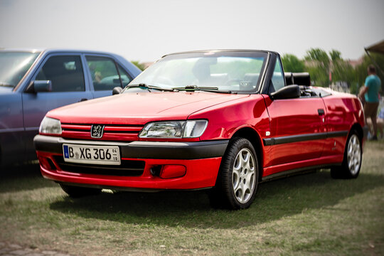 WERDER (HAVEL), GERMANY - MAY 20, 2023: The small family car Peugeot 306 Cabriolet. Swirl bokeh. Art lens. Oldtimer - Festival Werder Classics 2023