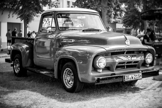 WERDER (HAVEL), GERMANY - MAY 20, 2023: Full-size pickup truck Ford F-100. Swirl bokeh. Art lens. Black and white. Oldtimer - Festival Werder Classics 2023