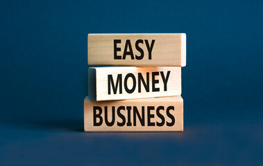 Easy money business symbol. Concept words Easy money business on beautiful wooden blocks. Beautiful grey table grey background. Easy money business concept. Copy space.