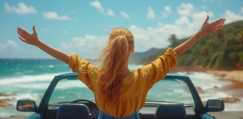 A joyful woman revels in the freedom of the open sky and warm sun as she cruises along the beach in a bright yellow convertible, her arms raised in celebration of the moment - obrazy, fototapety, plakaty