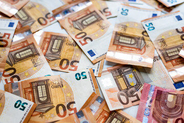 Euro banknotes money (EUR), currency of the European Union.
Euro banknotes of different denominations on a white background close-up