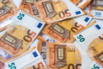 Euro banknotes money (EUR), currency of the European Union.
Euro banknotes of different denominations on a white background close-up