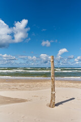 Wooden post on the sea beach - 721523198