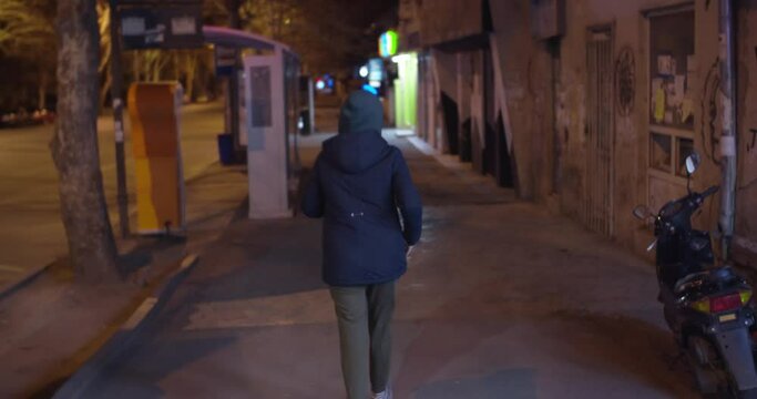 Girl walking alone at night 