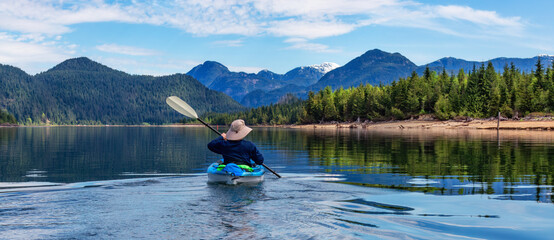 Kayaking in Canadian Mountain Landscape lake