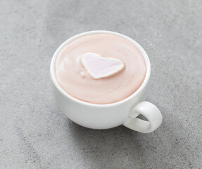 Chocolate cappuccino with marshmallows in the shape of a heart. In a cup. Light grey background....