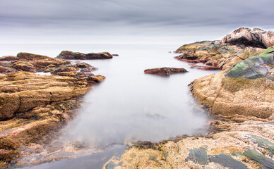 Small rocky inlet at sunrise, long exposure, near Pemaquid, Maine