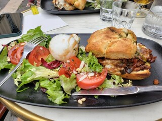 Mediterranean food plate with green salad in a restaurant