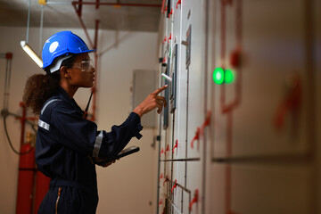 Women in Manufacturing, and female electrical engineers check MDB daily, electrical control room