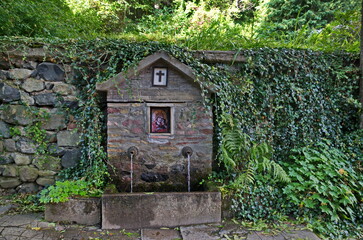 A stone fountain in the courtyard of the Dragalevsky  Monastery "Assumption of the Virgin Mary" in Vitosha mountain, Bulgaria 
