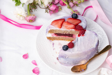 Trendy bento cake in love heart shape form on a light breakfast in bed background. Cake for Valentine's Day, Mother's Day, or Birthday, Love Forever Message, Romantic Bento Cake for Two